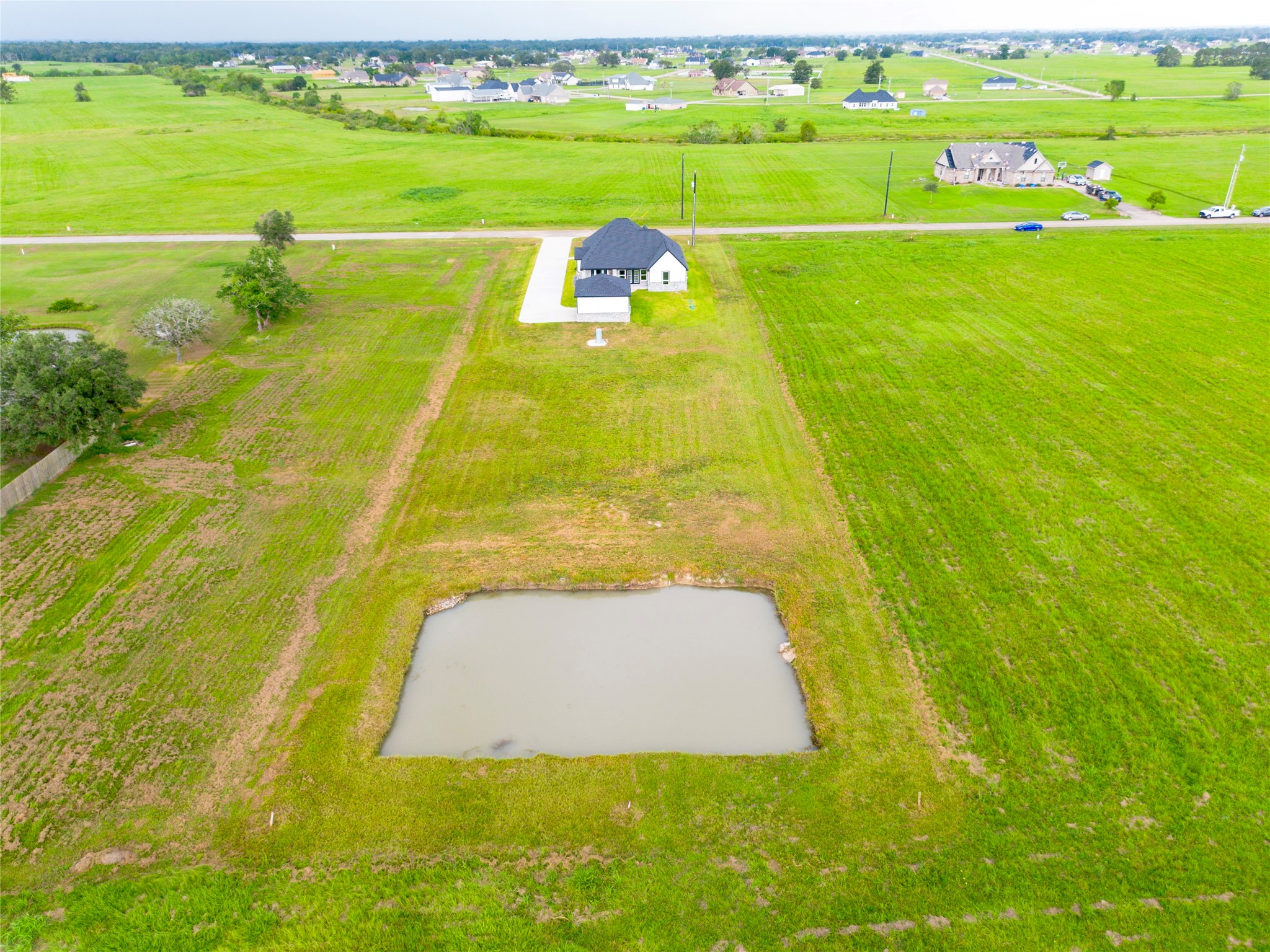 395 Brahman Trail Angleton, TX 77515 - Photo 26 of 31 filled fish pond