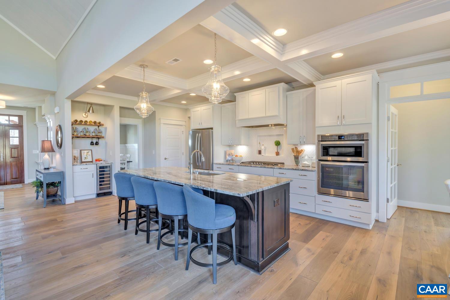 3 Jarmans Gap Road, Unit LOT 3 JARMANS GAP Crozet, VA 22932 - Photo 12 of 32 a kitchen with stainless steel appliances granite countertop a table chairs sink refrigerator and cabinets
