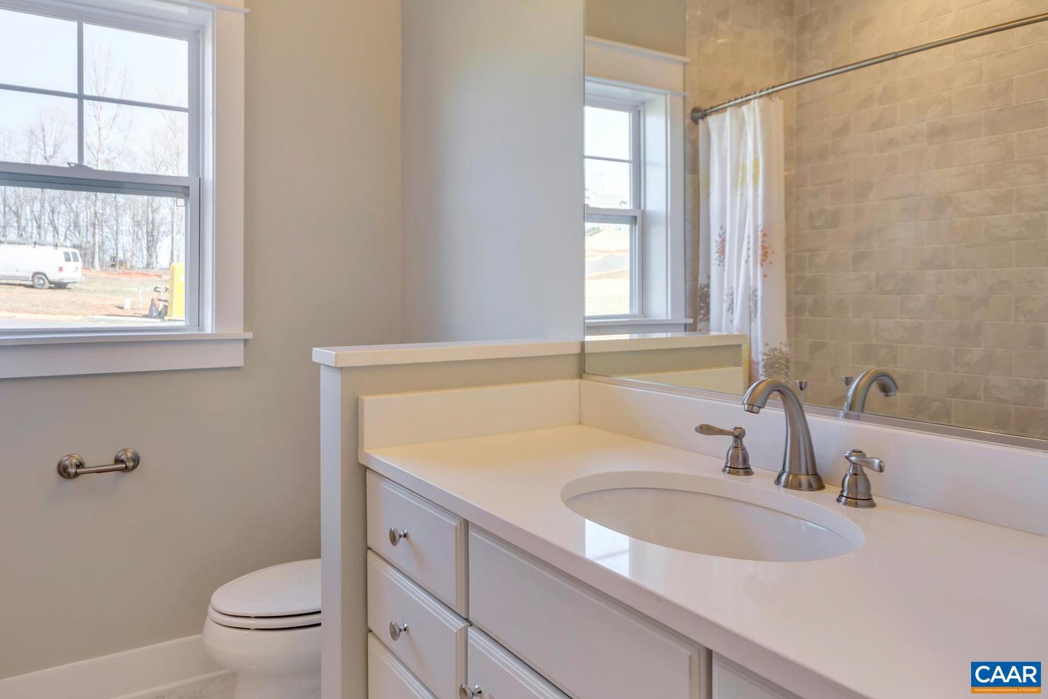 3 Jarmans Gap Road, Unit LOT 3 JARMANS GAP Crozet, VA 22932 - Photo 19 of 32 a bathroom with a sink a toilet and a window