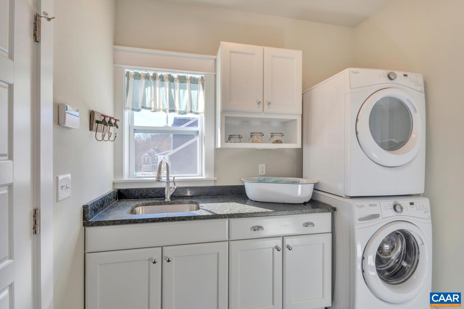 3 Jarmans Gap Road, Unit LOT 3 JARMANS GAP Crozet, VA 22932 - Photo 23 of 32 a kitchen with a sink and a washer dryer