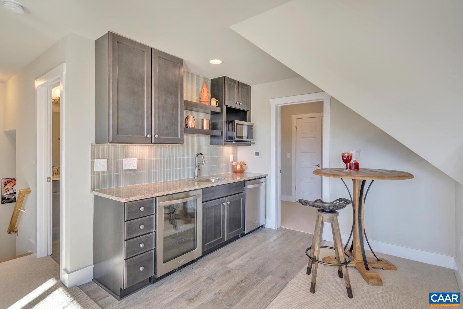 3 Jarmans Gap Road, Unit LOT 3 JARMANS GAP Crozet, VA 22932 - Photo 27 of 32 a kitchen with stainless steel appliances a stove a sink cabinets and a refrigerator