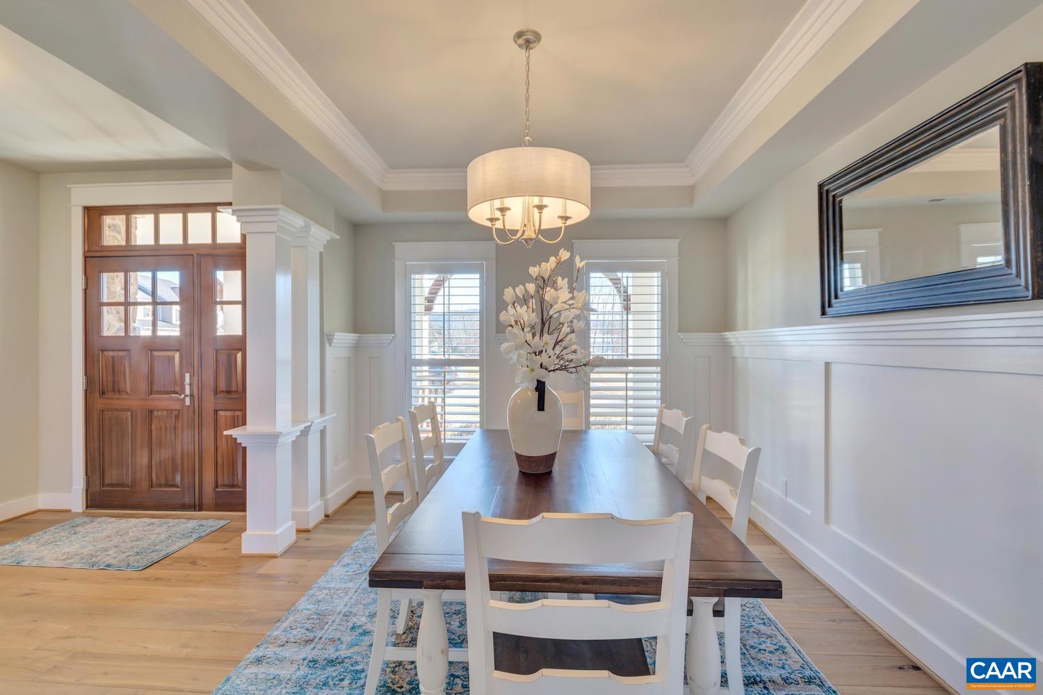 3 Jarmans Gap Road, Unit LOT 3 JARMANS GAP Crozet, VA 22932 - Photo 10 of 32 a dining room with wooden floor a chandelier a wooden table and chairs