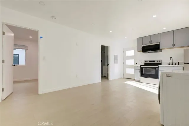 a view of kitchen with microwave and stove
