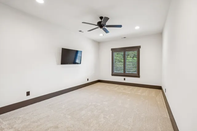 a bedroom with a bed couch and window