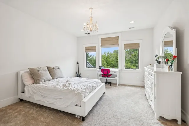 a bathroom with a granite countertop sink a mirror and a shower