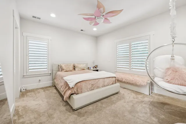 a bathroom with a granite countertop tub sink toilet and mirror