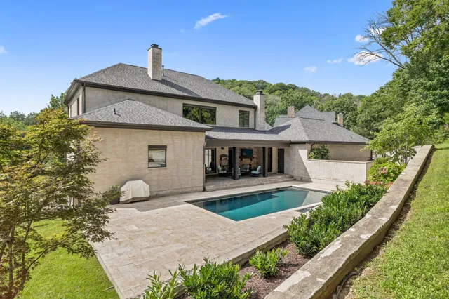 a living room with furniture fireplace and flat screen tv