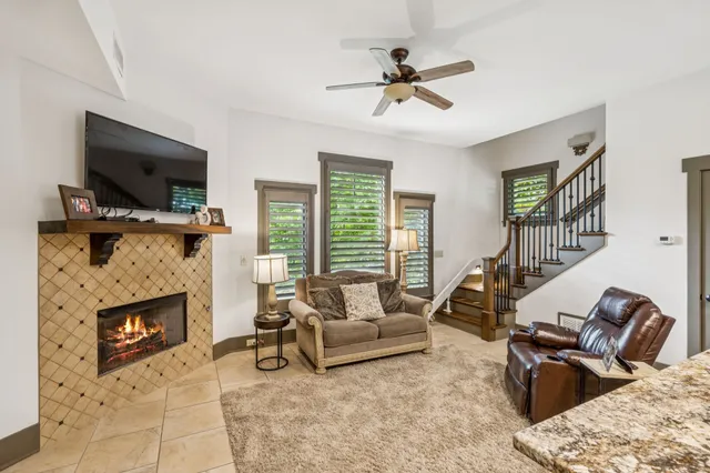 a kitchen with stainless steel appliances granite countertop a refrigerator a stove and a sink with granite countertops