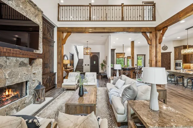 a large kitchen with stainless steel appliances granite countertop a lot of counter space and a window