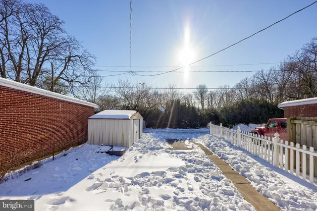 a view of a backyard with sitting area