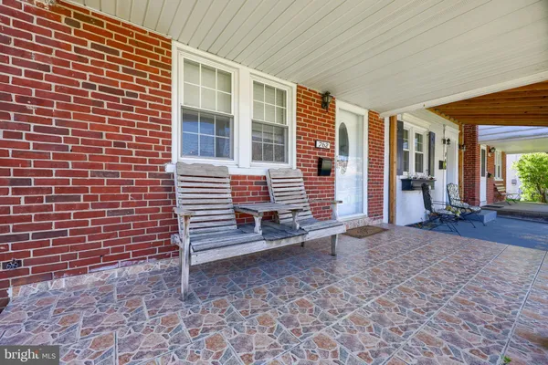 a view of a brick house with many windows