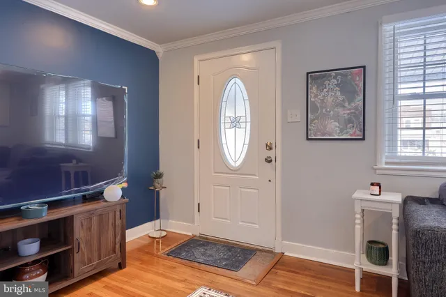 a view of an entryway with wooden floor
