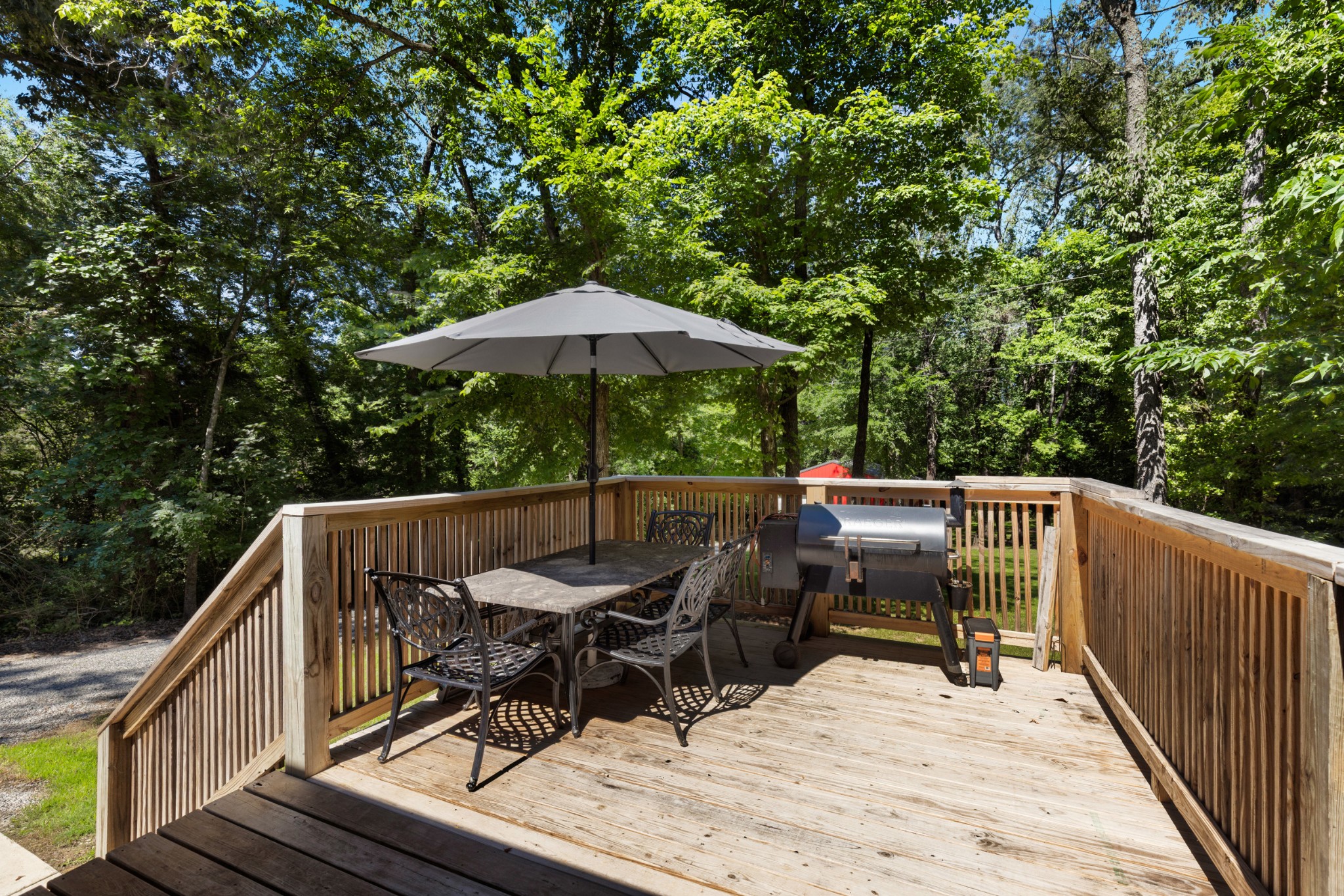 115 North Adams Street Adams, TN 37010 - Photo 42 of 44 a view of balcony with wooden floor and outdoor seating