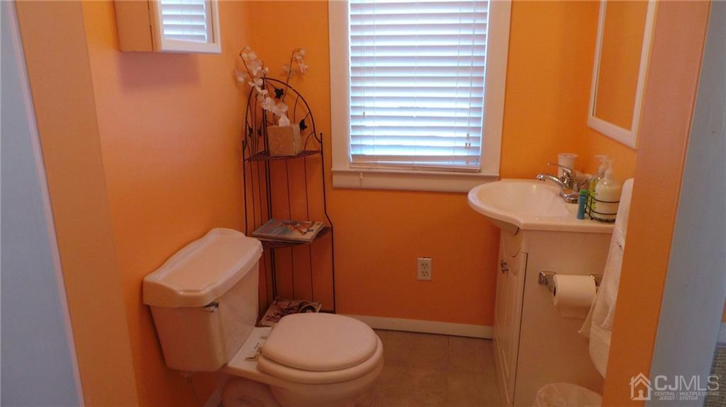 57 Orange Street Edison, NJ 08817 - Photo 13 of 15 a bathroom with a toilet and a sink
