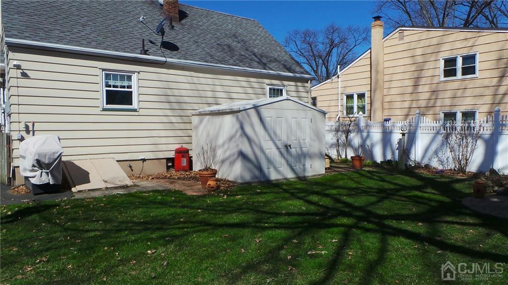 57 Orange Street Edison, NJ 08817 - Photo 14 of 15 a view of backyard with a garden and deck