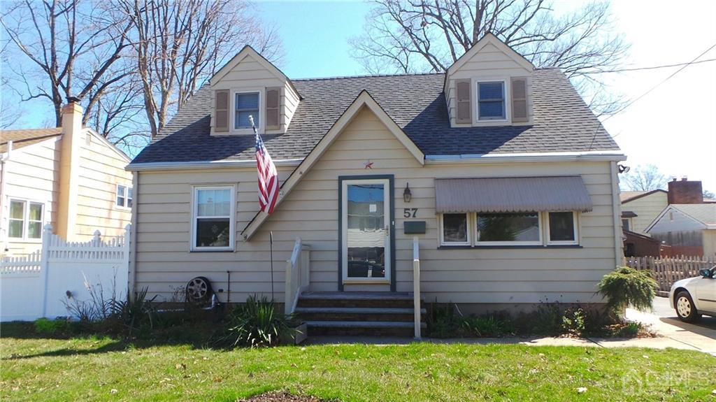 57 Orange Street Edison, NJ 08817 - Photo 2 of 15 a front view of a house with a yard
