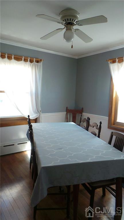 57 Orange Street Edison, NJ 08817 - Photo 7 of 15 a bed sitting in a bedroom next to a window