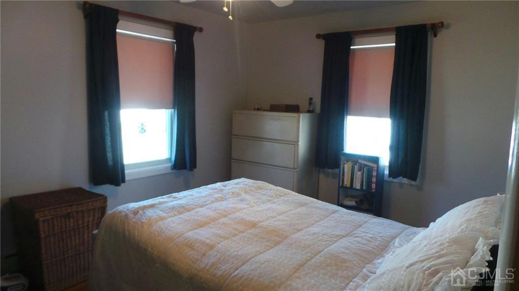 57 Orange Street Edison, NJ 08817 - Photo 9 of 15 a bedroom with a bed and a window