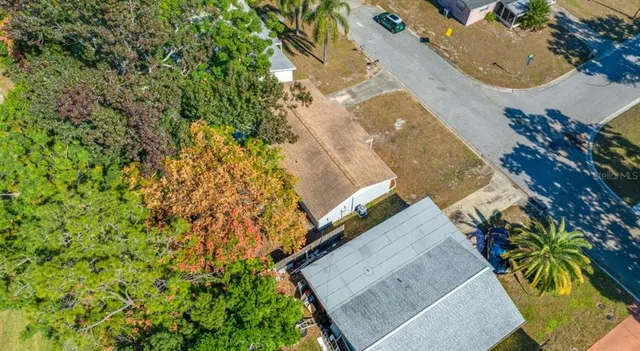 an aerial view of house with yard