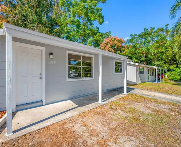 a house view with a backyard space
