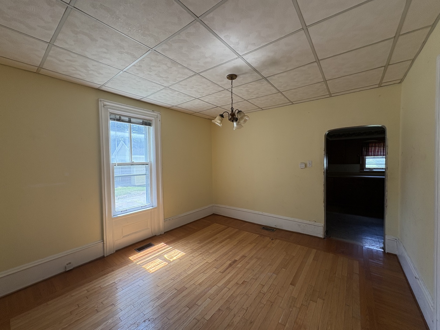 411 Depot Street Mazon, IL 60444 - Photo 12 of 34 a view of empty room with wooden floor and fan