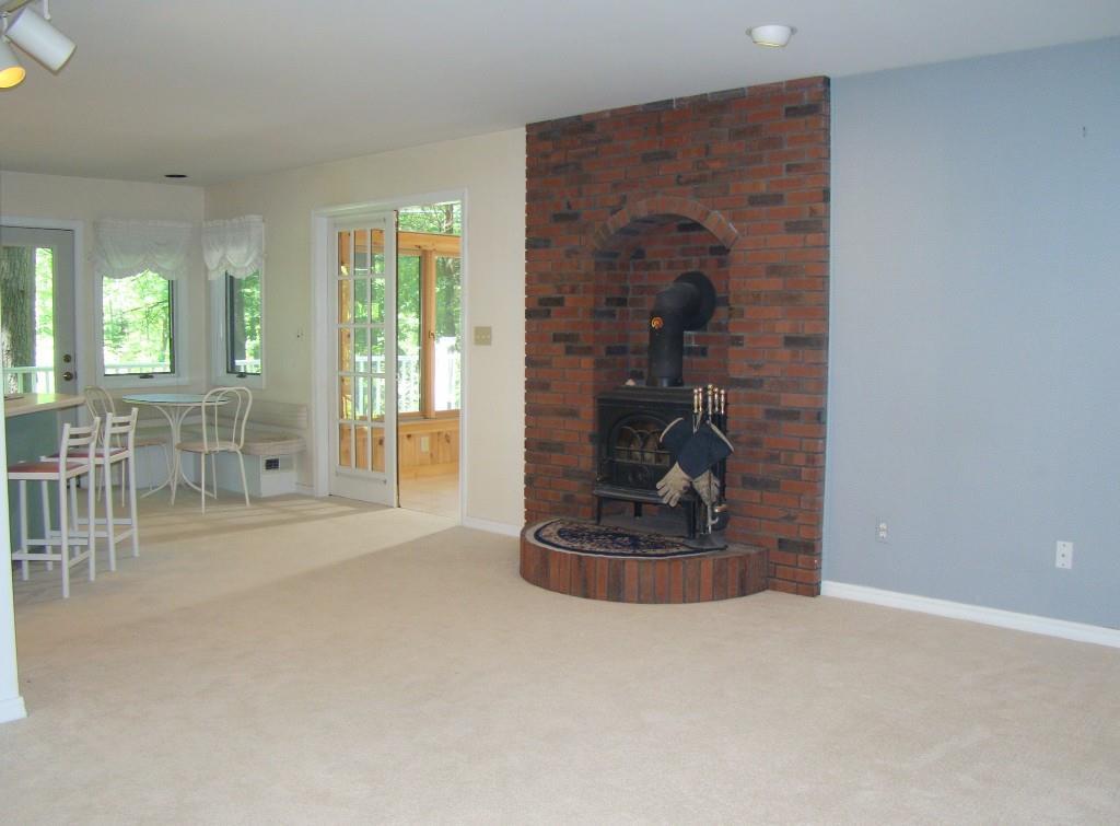 186 Cedarwood Road Auburn, ME 04210 - Photo 13 of 35 Family room open to kitchen & brick...