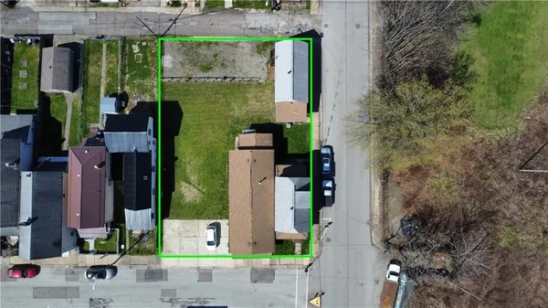 aerial view of a house with a garden