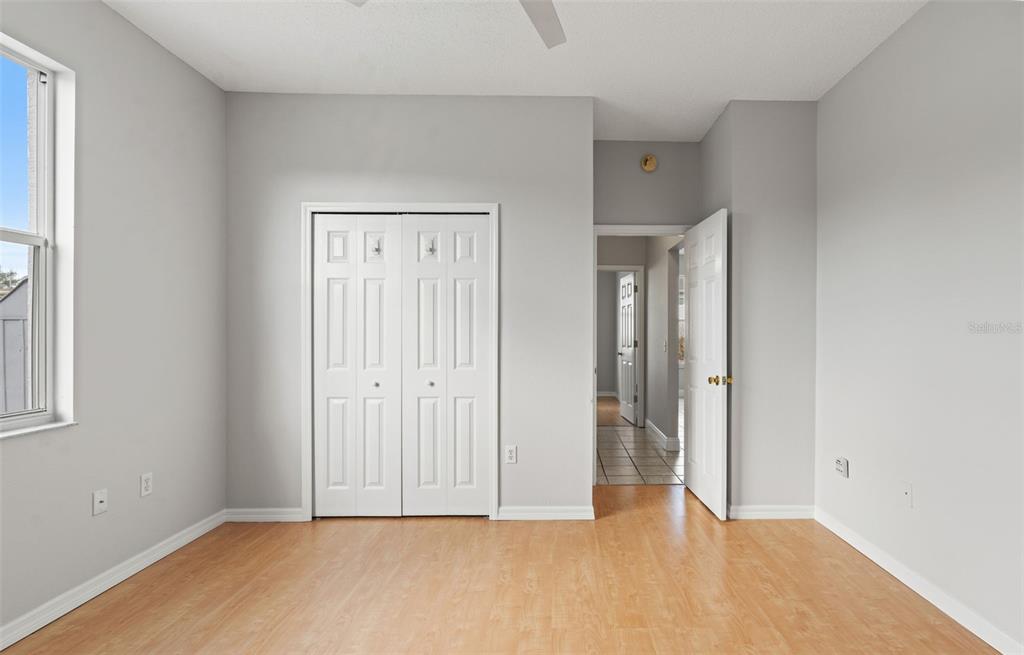 8433 Beachwood Court Spring Hill, FL 34606 - Photo 18 of 38 a view of an empty room with wooden floor
