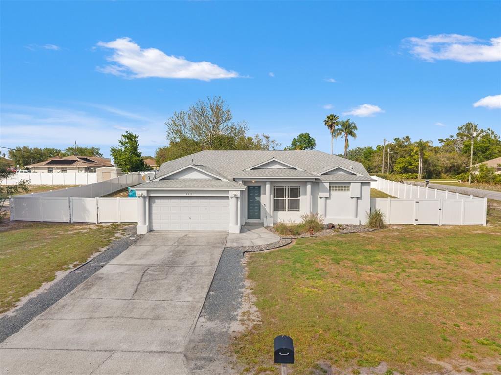 8433 Beachwood Court Spring Hill, FL 34606 - Photo 2 of 38 a front view of a house with a yard