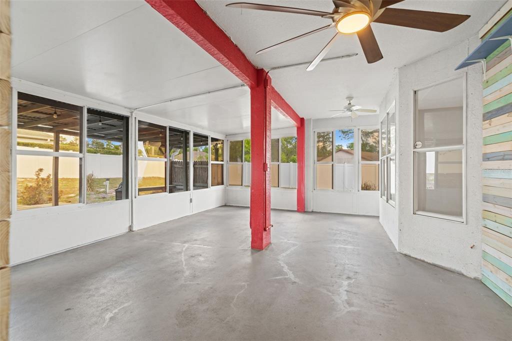 8433 Beachwood Court Spring Hill, FL 34606 - Photo 21 of 38 a view of an empty room with a window