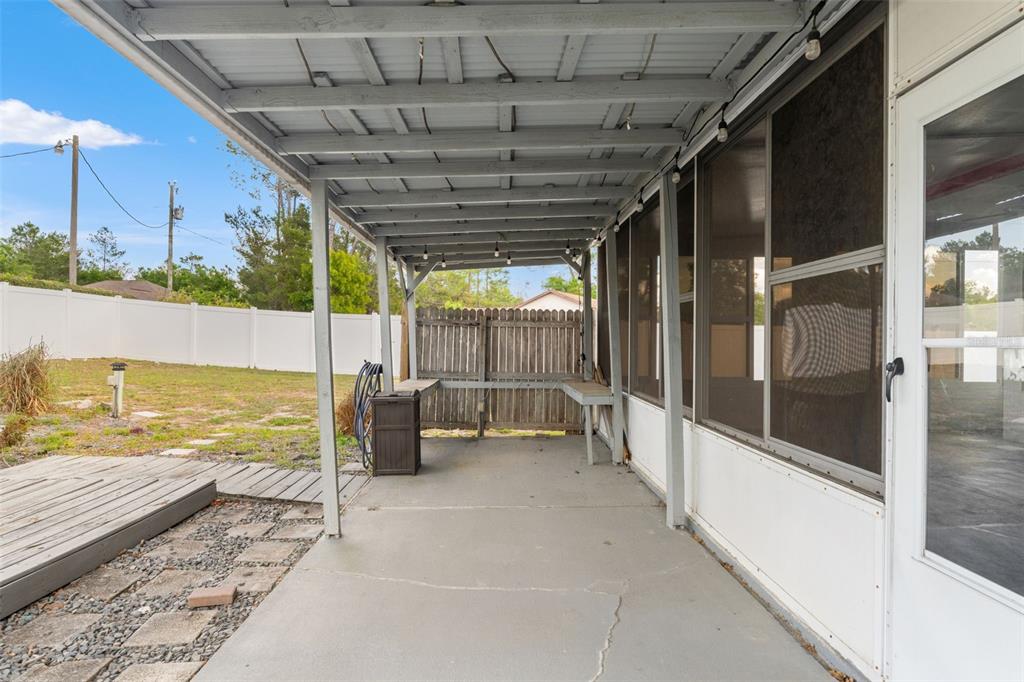 8433 Beachwood Court Spring Hill, FL 34606 - Photo 25 of 38 a view of a swimming pool with an outdoor seating