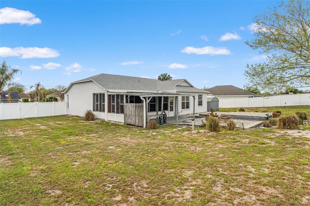 8433 Beachwood Court Spring Hill, FL 34606 - Photo 29 of 38 a view of a house with a swimming pool