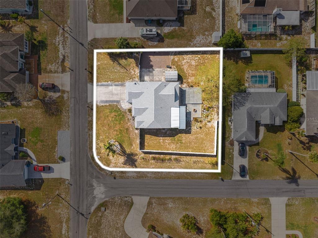 8433 Beachwood Court Spring Hill, FL 34606 - Photo 3 of 38 an aerial view of a house with a swimming pool