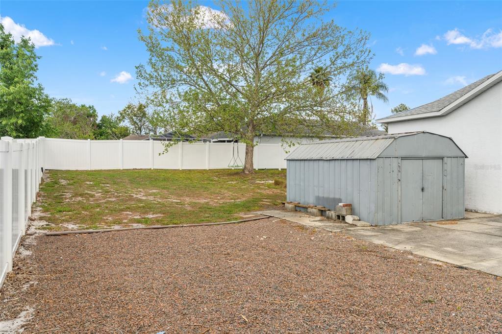 8433 Beachwood Court Spring Hill, FL 34606 - Photo 32 of 38 a view of a house with backyard and trees