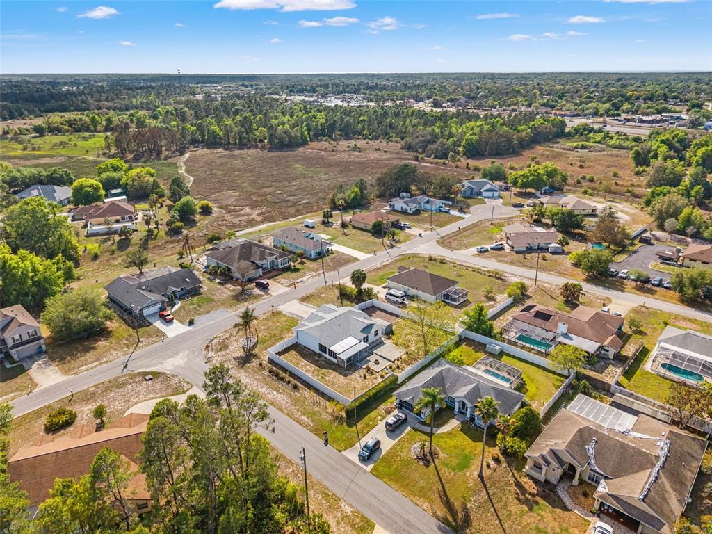 8433 Beachwood Court Spring Hill, FL 34606 - Photo 37 of 38 an aerial view of residential building with parking
