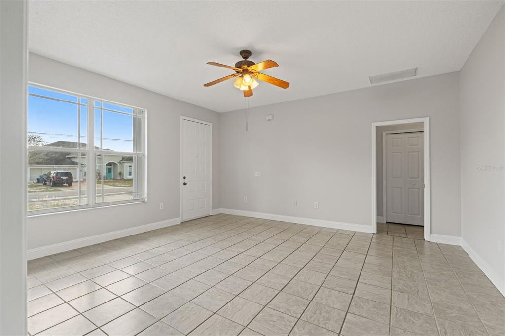 8433 Beachwood Court Spring Hill, FL 34606 - Photo 4 of 38 a view of an empty room and window