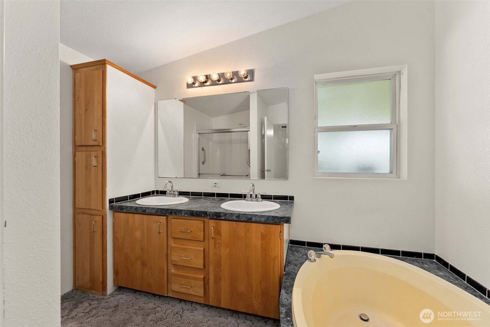 312 McGlaughlin Road Winlock, WA 98596 - Photo 14 of 40 a bathroom with a granite countertop sink and a mirror