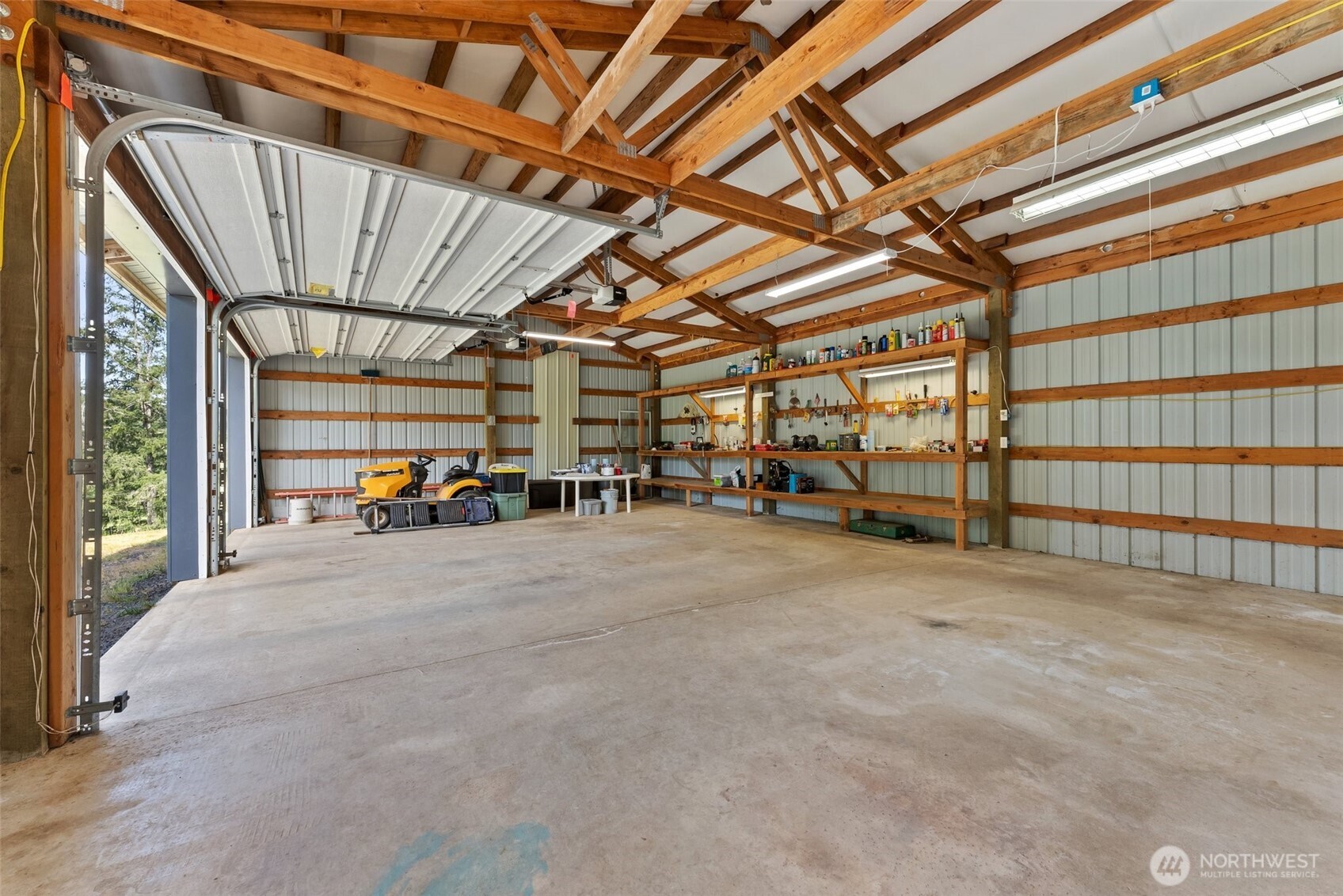 312 McGlaughlin Road Winlock, WA 98596 - Photo 24 of 40 a view of a garage with wooden floor