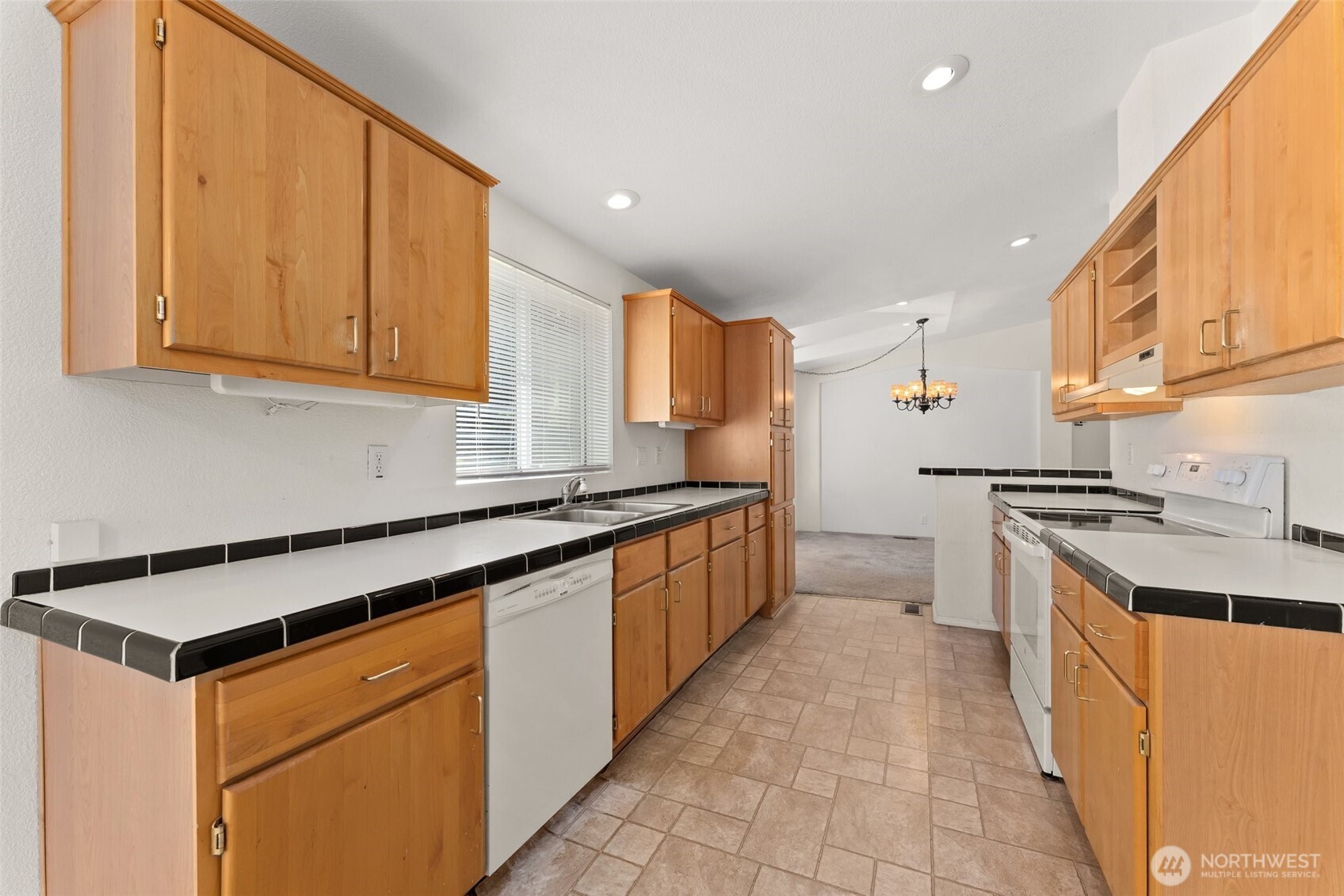 312 McGlaughlin Road Winlock, WA 98596 - Photo 10 of 40 a kitchen with stainless steel appliances granite countertop a stove a sink and a refrigerator