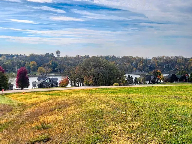a view of a swimming pool and a yard