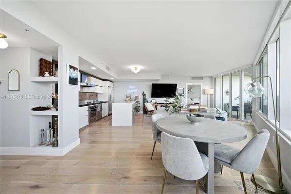 a view of kitchen and dining area with furniture
