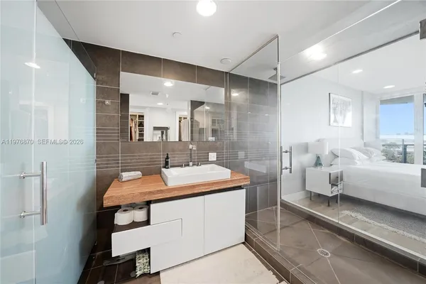 a bathroom with a double vanity sink and mirror