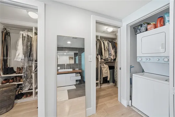 a view of a kitchen with storage and utility room