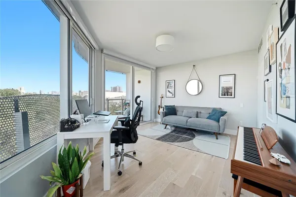 a living room with furniture and a large window