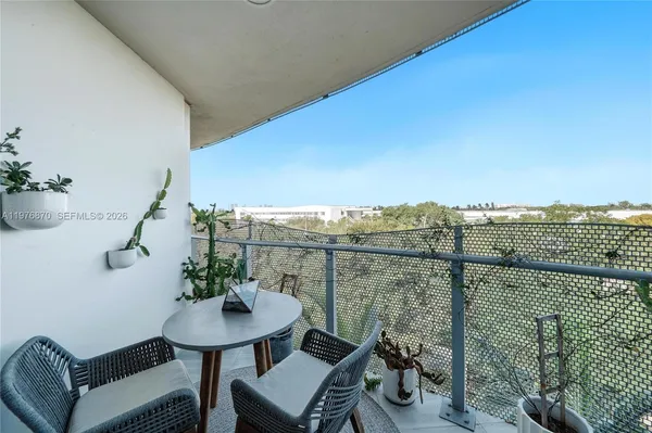 a view of a balcony and chairs