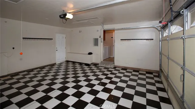 a kitchen with a sink and a mirror