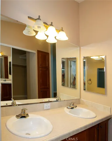 a white toilet sitting next to a shower