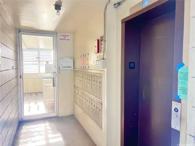 a view of a hallway with windows