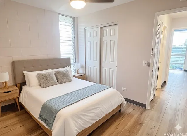 a bedroom with bed and window