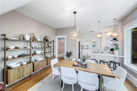 a kitchen with sink and refrigerator